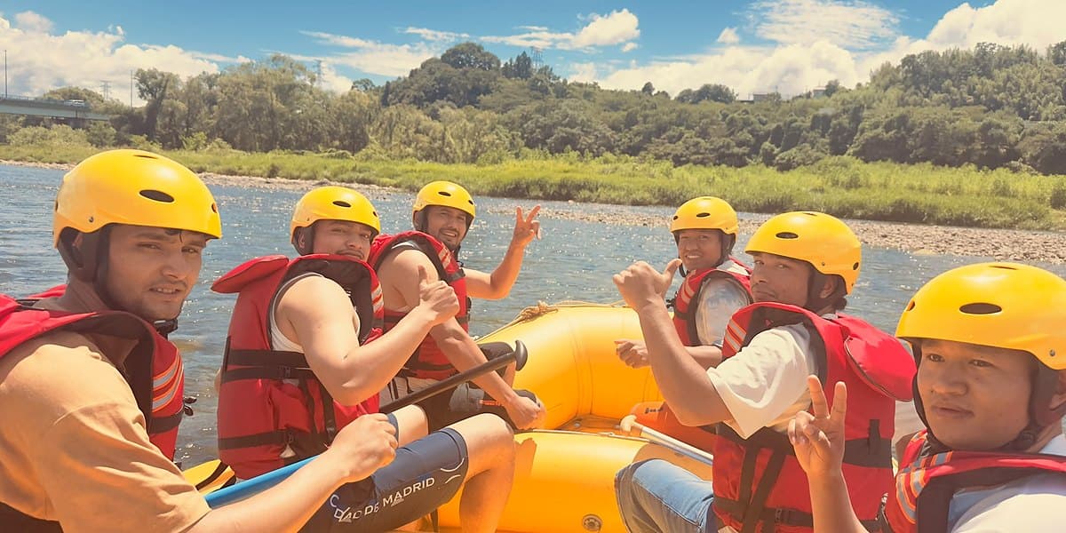 Dream Adventure rafting group smiling in the boat on the Tone River